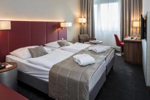 Postel nebo postele na pokoji v ubytování Austria Trend Hotel Europa Salzburg