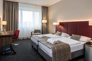 Postel nebo postele na pokoji v ubytování Austria Trend Hotel Europa Salzburg