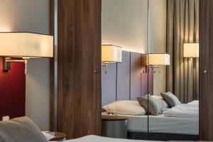 Postel nebo postele na pokoji v ubytování Austria Trend Hotel Europa Salzburg