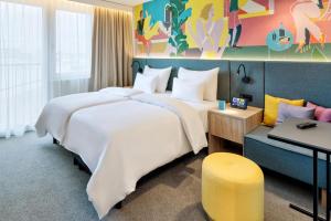 Postel nebo postele na pokoji v ubytování Spark by Hilton Vienna Messe Prater