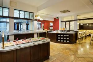 Un restaurant u otro lugar para comer en Austria Trend Hotel Ananas Wien