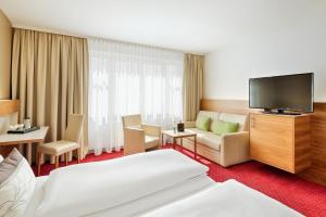 TV a/nebo společenská místnost v ubytování Austria Trend Hotel Anatol Wien