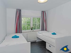 Ein Bett oder Betten in einem Zimmer der Unterkunft Kirchstr 4a