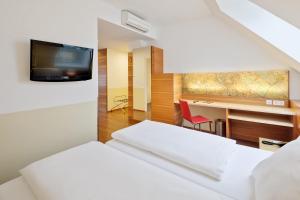 Posteľ alebo postele v izbe v ubytovaní Austria Trend Hotel beim Theresianum Wien