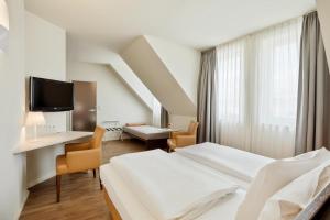Posteľ alebo postele v izbe v ubytovaní Austria Trend Hotel beim Theresianum Wien