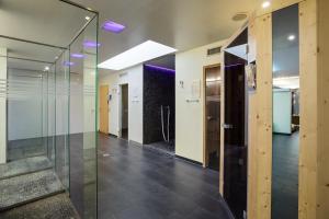 a hallway of an office with glass doors and stairs at Austria Trend Hotel Congress Innsbruck in Innsbruck