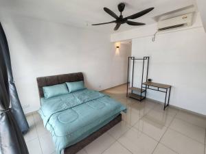 a bedroom with a bed with a ceiling fan at Cozy 2room 7pax, Menara Sentral in Bukit Mertajam