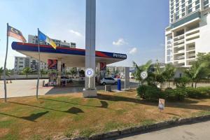 a gas station with a plane on top of it at Cozy 2room 7pax, Menara Sentral in Bukit Mertajam
