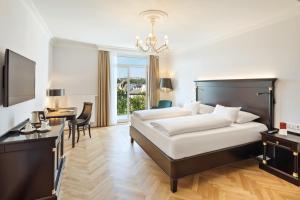 Кровать или кровати в номере Austria Trend Parkhotel Schönbrunn Wien
