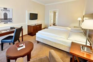 Кровать или кровати в номере Austria Trend Parkhotel Schönbrunn Wien