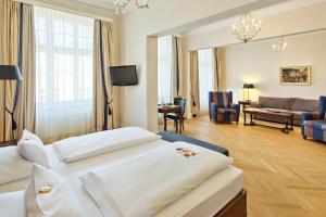 Кровать или кровати в номере Austria Trend Parkhotel Schönbrunn Wien