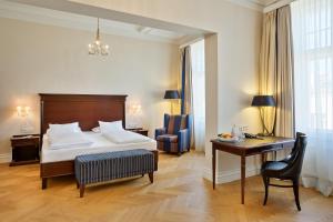 Кровать или кровати в номере Austria Trend Parkhotel Schönbrunn Wien