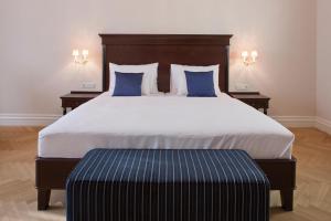 Кровать или кровати в номере Austria Trend Parkhotel Schönbrunn Wien