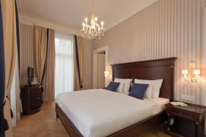 Кровать или кровати в номере Austria Trend Parkhotel Schönbrunn Wien