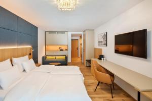 Postel nebo postele na pokoji v ubytování Austria Trend Hotel Maximilian