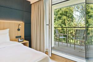 Postel nebo postele na pokoji v ubytování Austria Trend Hotel Maximilian
