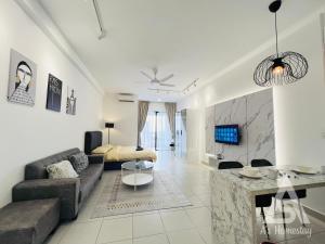 a living room with a couch and a table at Netizen Soho 2pax walking distance MRT Cheras Wi-Fi AsHome in Cheras