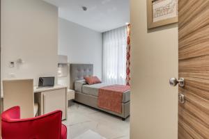 Posteľ alebo postele v izbe v ubytovaní Vomero High Hotel