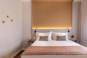 a bedroom with a large white bed with two pillows at Blue Tree Towers Anália Franco - Tatuapé in Sao Paulo