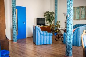 TV a/nebo společenská místnost v ubytování Apartmány Batelov