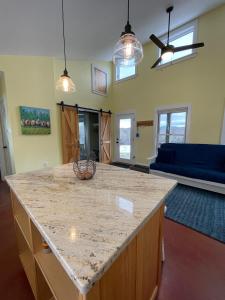 a kitchen with a large counter top in a room at Fat Sheep Farm & Cabins in Windsor