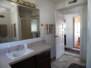 a bathroom with a sink and a mirror at Sunset Inn in South Haven +109 photos