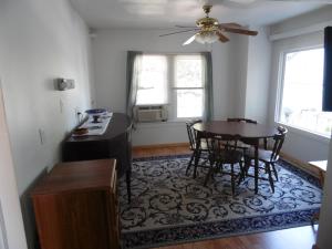 a kitchen with a table and chairs in a room at Sunset Inn in South Haven