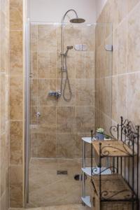 a shower with a glass door in a bathroom at Kőszikla Vendégház a csendes pihenésre vágyóknak! in Kismaros +23 photos