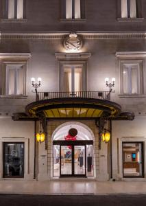 a building with an arch over the door of a store at Risorgimento Resort in Lecce