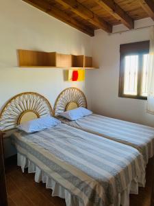 a bedroom with two beds in a room at La Venta in Purchena