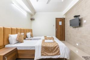 TV a/nebo společenská místnost v ubytování Hotel Sanmati