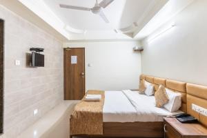 Postel nebo postele na pokoji v ubytování Hotel Sanmati