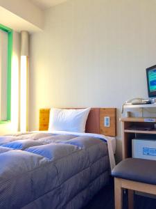 Letto o letti in una camera di R&B Hotel Kobe Motomachi