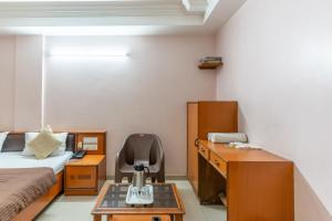 Postel nebo postele na pokoji v ubytování Hotel Sanmati