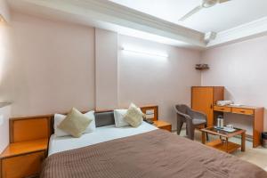 Postel nebo postele na pokoji v ubytování Hotel Sanmati