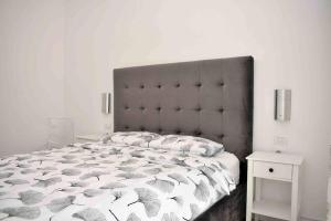 a bedroom with a large bed with umbrellas on it at Super Villa for vacation Gjiri i Lalzit in Draç +19 photos