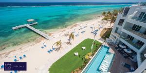 an aerial view of a beach and the ocean at Rum Point Club Resort Luxury Beachfront Condos by Grand Cayman Villas & Condos in Driftwood Village