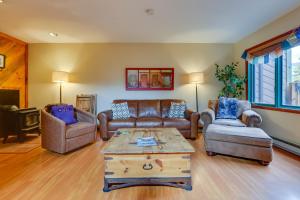 a living room with couches and a coffee table at 2 Mi to Ski Resort Mountain Home with Hot Tub! in Frisco