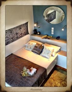 Giường trong phòng chung tại Aperanto Galazio