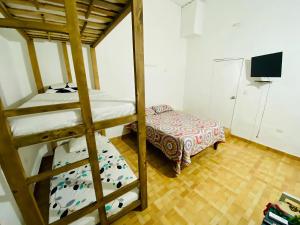 Postel nebo postele na pokoji v ubytování Hostal Badillo SV