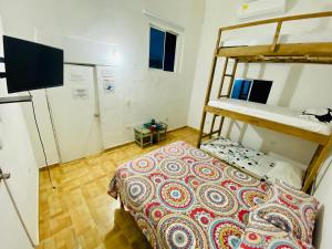 Postel nebo postele na pokoji v ubytování Hostal Badillo SV