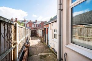 a view of an alley from a window at Spacious 3 Bed House With Free Parking in Doncaster