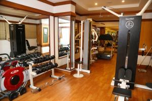 a gym with a bunch of equipment in a room at Gokulam Park Hotel & Convention Centre in Cochin