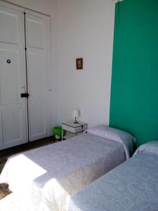 Ein Bett oder Betten in einem Zimmer der Unterkunft Casa Escuela