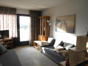 a living room with a couch and a window at Ferienwohnung L408 für 2-4 Personen an der Ostsee in Brasilien