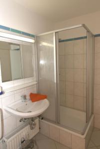 a bathroom with a sink and a shower at Ferienappartement K312 für 2-3 Personen in Strandnähe in Brasilien