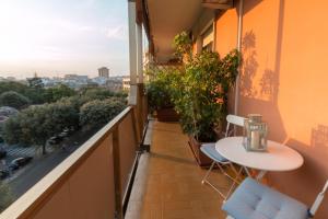 a balcony with a table and chairs and a view at Larala' in Lecce