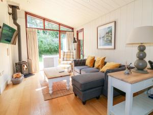 a living room with a couch and a table at Clipsham in Cottesmore