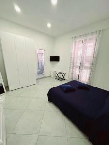 A bed or beds in a room at Dimora Asmara 11 15