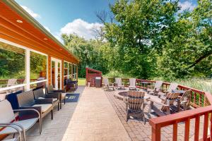 a patio with chairs and tables on a building at Lefty's in Bentonville